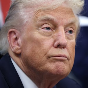 President Donald Trump (L) answers questions while childhood cancer survivors and their families gather in the Oval Office at the White House on September 30, 2025 in Washington, DC.