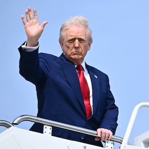 US President Donald Trump waves as he boards Air Force One at Joint Base Andrews in Maryland on April 3, 2025.