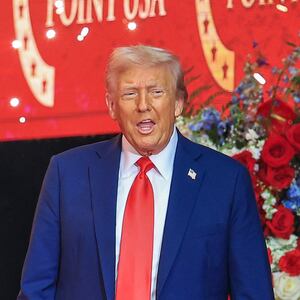 GLENDALE, ARIZONA - SEPTEMBER 21: U.S. President Donald Trump walks onstage during the memorial service for political activist Charlie Kirk at State Farm Stadium on September 21, 2025 in Glendale, Arizona. Kirk, the CEO and co-founder of Turning Point USA, was shot and killed on September 10th while speaking at an event during his "American Comeback Tour" at Utah Valley University. (Photo by Joe Raedle/Getty Images)