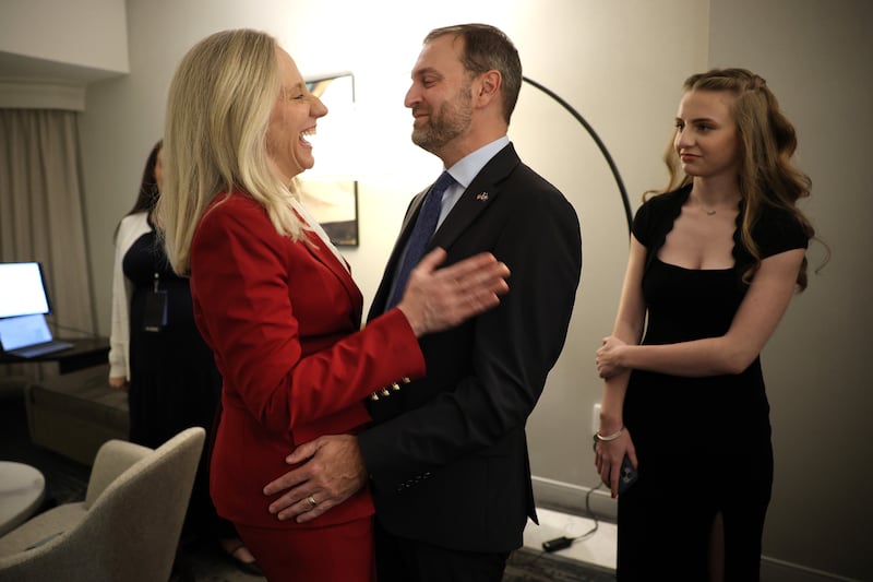 Virginia Democratic gubernatorial candidate, former Rep. Abigail Spanberger embraces her husband Adam after being declared the winner of the Virginia Governor race prior to her election night watch party at the Greater Richmond Convention Center on November 04, 2025 in Richmond, Virginia.
