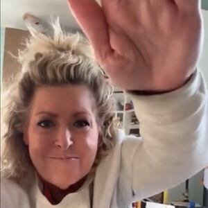 Laura Smith saluting her TikTok followers.
