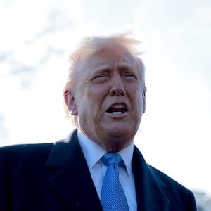 Donald Trump speaks to reporters before boarding Marine One at the White House on March 21, 2025 in Washington, D.C.