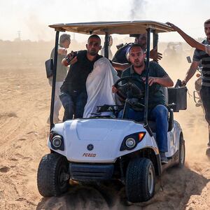 An Israeli hostage is taken to Gaza City.