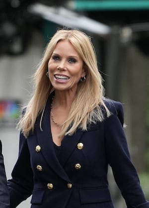WASHINGTON, DC - MAY 22: Health and Human Services Secretary Robert F. Kennedy Jr. and his wife Cheryl Hines walk together at the White House on May 22, 2025 in Washington, DC. Kennedy was at the White House today to release a new Make America Healthy Again Commission report that blamed the rise in chronic illnesses on ultraprocessed foods, chemical exposures, lifestyle factors and excessive use of prescription drugs. (Photo by Kevin Dietsch/Getty Images)