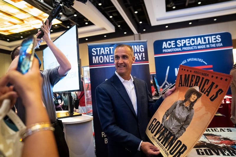 Corey R. Lewandowski holds a poster for South Dakota Gov. Kristi Noem during the Conservative Political Action Conference CPAC held at the Hyatt Regency Orlando on Saturday, Feb 27, 2021 in Orlando, FL.