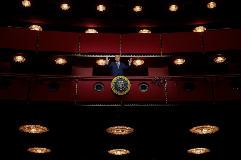 Trump looks down from the Presidential Box in the center's Opera House after a board meeting.