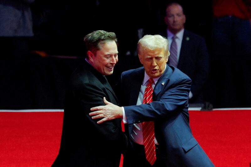 President-elect Donald Trump greets Elon Musk during a rally in Washington, D.C. on  January 19, 2025.