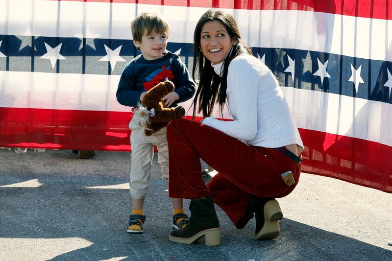 Katie Miller and her son at a Donald Trump campaign rally last year. She married the top Trump adviser Stephen Miller in 2020 with the president in attendance.