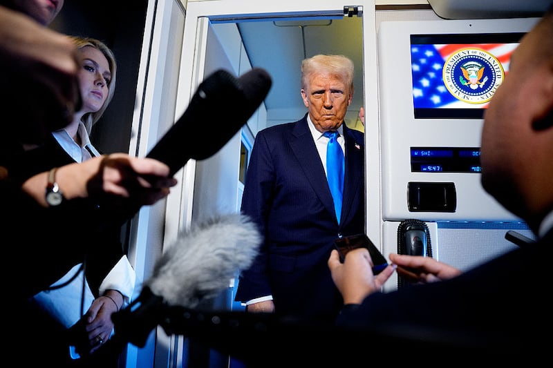 U.S. President Donald Trump speaks to journalists aboard Air Force One en route to South Korea on October 29, 2025 in Japan. Trump is traveling to South Korea for the APEC meetings, following an appearance at the ASEAN summit in Malaysia, and a trip to Japan.