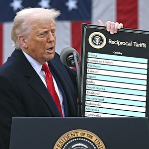 US President Donald Trump holds a chart as he delivers remarks on reciprocal tariffs during an event in the Rose Garden entitled "Make America Wealthy Again" at the White House in Washington, DC, on April 2, 2025.