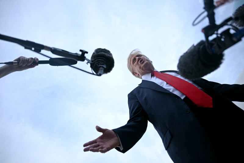 President Donald Trump speaks with the press upon arrival at Joint Base Andrews in Maryland on July 13, 2025 after attending the 2025 FIFA Club World Cup final in East Rutherford, New Jersey.