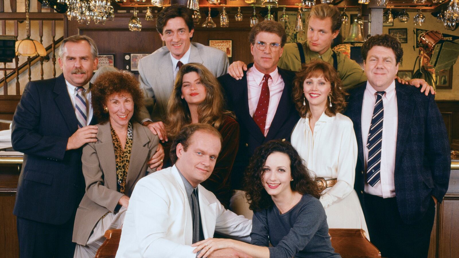Cheers cast (l-r) John Ratzenberger as Cliff Clavin, Rhea Perlman as Carla LeBec, Roger Rees as Robin Colcord, Kirstie Alley as Rebecca Howe, Kelsey Grammer as Dr. Frasier Crane, Ted Danson as Sam Malone, Bebe Neuwirth as Dr. Lilith Sternin-Crane, Shelley Long as Diane Chambers, Woody Harrelson as Woody Boyd, George Wendt as Norm Peterson.