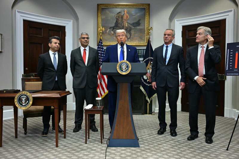 President Donald Trump (C), alongside (L-R) FDA Commissioner Marty Makary,  National Institute of Health (NIH) Director Jayanta Bhattacharya, Secretary of Health and Human Services Robert F. Kennedy Jr and Administrator for the Centers for Medicare and Medicaid Services Mehmet Oz, speaks during a news conference about prescription drug prices, in the Roosevelt Room of the White House on May 12, 2025, in Washington, DC.