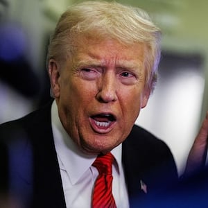 U.S. President Donald Trump speaks to reporters aboard Air Force One en route to the White House on November 2, 2025 after taking off from Palm Beach International Airport in West Palm Beach, Florida. Trump spent the weekend at his Mar-A-Lago estate in Palm Beach, Florida.