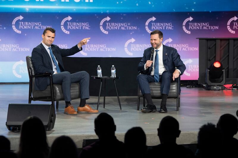 Charlie Kirk (L) moderates a conversation with JD Vance during Turning Point Action's Chase the Vote campaign event at Generation Church in Mesa, Arizona, on September 4, 2024.