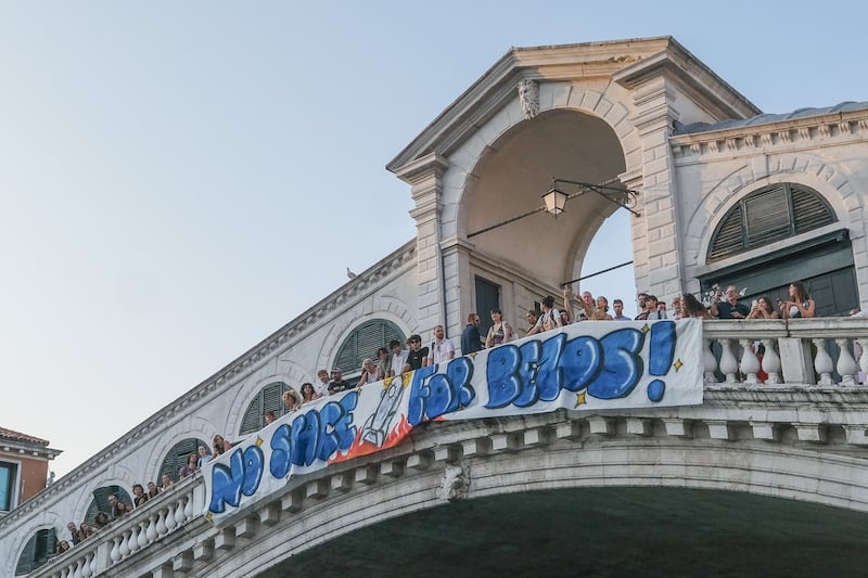 VENICE, ITALY - JUNE 13: Activists of “No Space For Bezos” displayed a banner on the Rialto Bridge to protest the wedding to be held in Venice from 26 to 28 June 2025 on June 13, 2025 in Venice, Italy. Venice is confirmed as the city of choice for the wedding of Amazon Group founder, owner and chairman Jeff Bezos to Lauren Sanchez. (Photo by Stefano Mazzola/Getty Images)