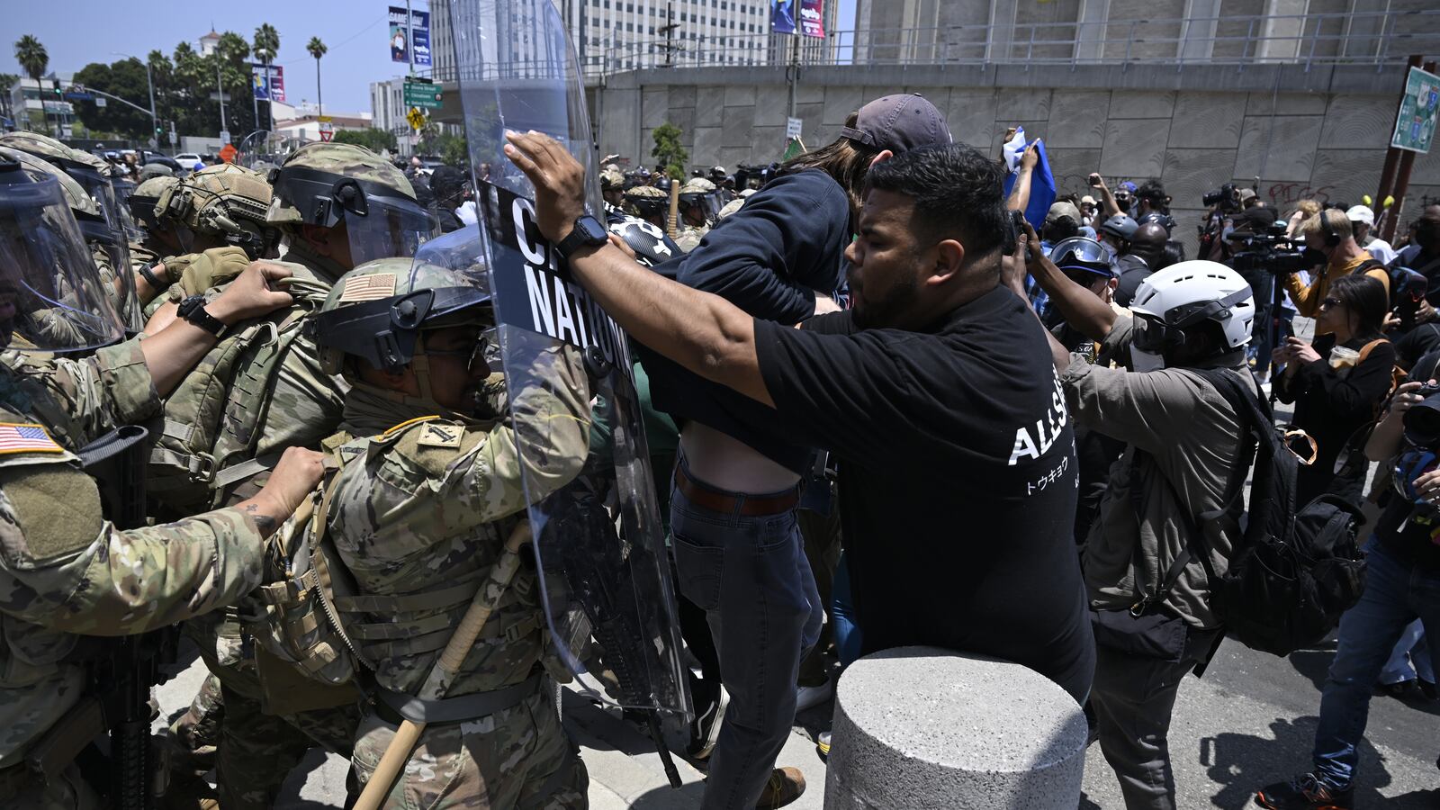 National guards confront with protesters outside of the Metropolitan Detention Center in Los Angeles.