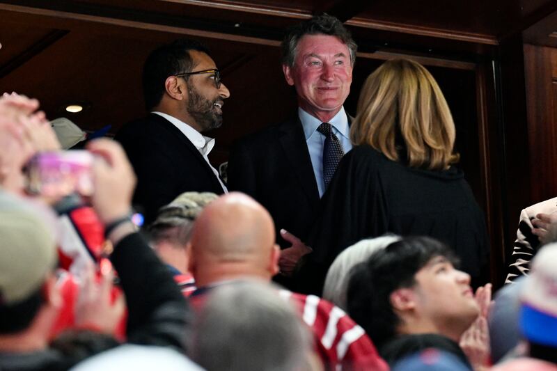 Wayne Gretzky, right, in the owners box with FBI Director Kash Patel on Friday.