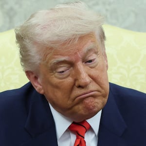 U.S. President Donald Trump reacts during a meeting with Canadian Prime Minister Mark Carney (not pictured) in the Oval Office at the White House in Washington, D.C., U.S., May 6, 2025.