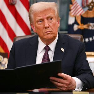 US President Donald Trump signs an executive order for pardons on January 6 offenders in the Oval Office of the WHite House in Washington, DC, on January 20, 2025.