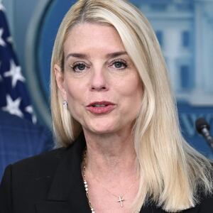 Pam Bondi during a press conference and FBI agenst speakign to a man on the street on D.C.