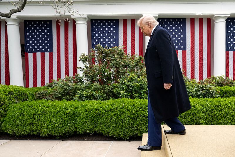 President Donald Trump walks away after signing an executive order on reciprocal tariffs during an event in the White House Rose Garden.