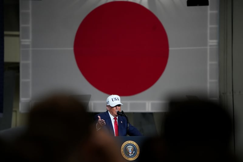 President Donald Trump speaks to troops aboard USS George Washington at Fleet Activities Yokosuka on October 28, 2025 in Yokosuka, Japan.