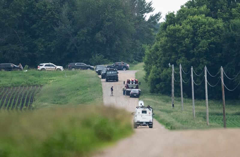 BELLE PLAINE, MINNESOTA - JUNE 15: A tow truck removes a vehicle as law enforcement searches the area on 301st Avenue on June 15, 2025 in Belle Plaine, Minnesota. Law enforcement agencies are searching for Vance Boelter, a suspect in the killing of DFL State Rep. Melissa Hortman and her husband, Mark Hortman, who were shot at their home yesterday. DFL State Sen. John Hoffman and his wife were also shot and hospitalized in a separate incident. Minnesota Gov. Tim Walz said during a press conference that the shooting "appears to be a politically motivated assassination." (Photo by Stephen Maturen/Getty Images)