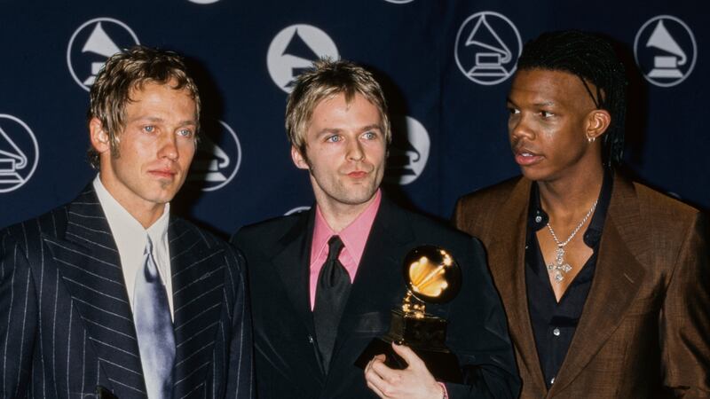 American Christian rap and rock band DC Talk (American singer, songwriter and poet Kevin Max Smith, American singer, songwriter and rapper TobyMac (Toby McKeehan), and American singer and songwriter Michael Tait) in the press room of the 39th Annual Grammy Awards, held at Madison Square Garden in Midtown Manhattan, New York City, New York, 26th February 1997. The trio won the Best Rock Gospel Album award for their album 'Jesus Freak'.