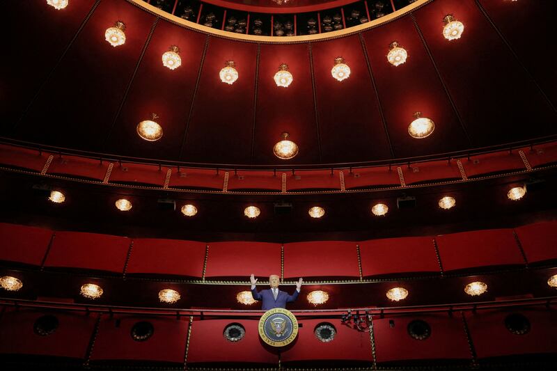President Donald Trump gestures while posing for a picture at the presidential box at the Kennedy Center, in Washington, D.C. on March 17, 2025.