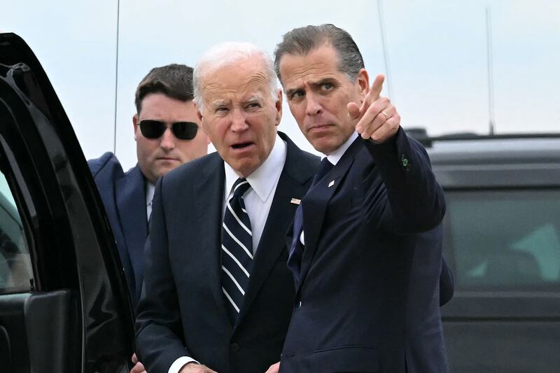 Joe Biden talks with his son Hunter Biden upon arrival at Delaware Air National Guard Base in New Castle, Delaware, on June 11, 2024,