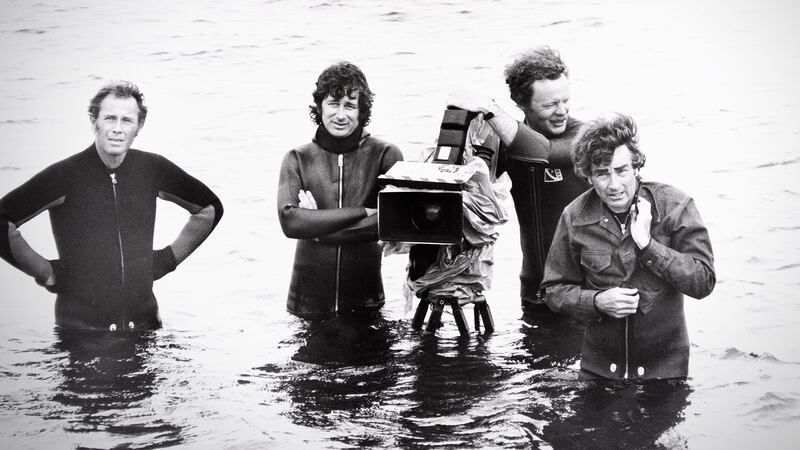 Steven Spielberg, Bill Butler, and crew on the set of Jaws in 1974.