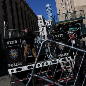 Men set up NYPD barricades outside Manhattan Criminal Court in New York City