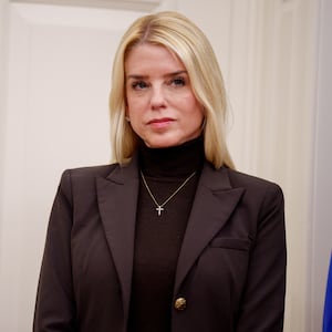 Attorney General Pam Bondi listens as U.S. President Donald Trump speaks after Tulsi Gabbard is sworn in as Director of National Intelligence in the Oval Office at the White House on February 12, 2025 in Washington, DC.