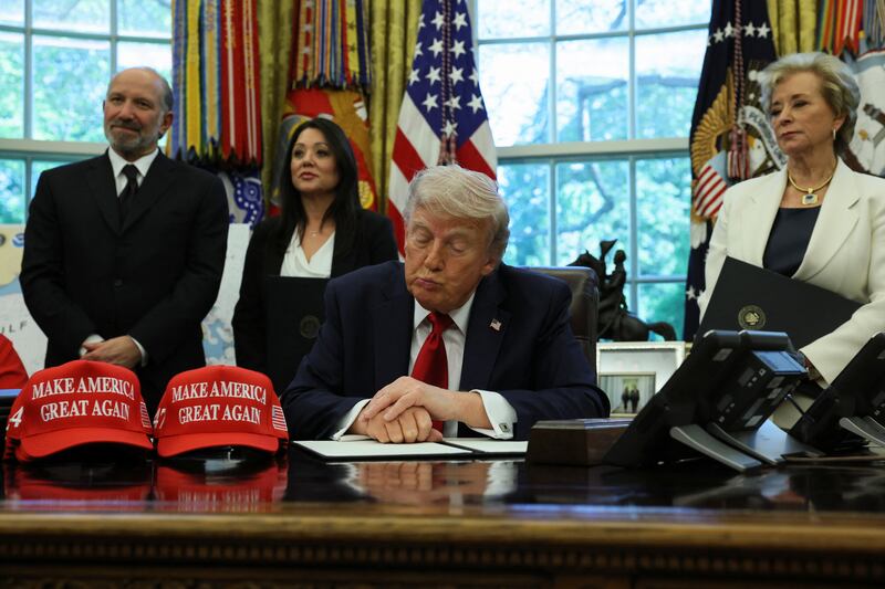 U.S. President Donald Trump gestures during an event to sign executive orders in the Oval Office at the White House in Washington, D.C., U.S., April 23, 2025. REUTERS/Leah Millis