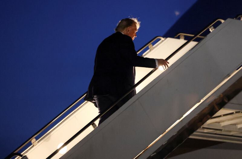 U.S. President Donald Trump boards Air Force One as he departs early from the G7 Leaders' Summit.
