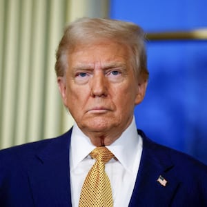 US President-elect Donald Trump looks on during a meeting with France's President at the Elysee Palace in Paris, on December 7, 2024. Trump makes his first international trip since his election win, preparing for a day of intense diplomacy before attending the reopening ceremony for the Notre Dame cathedral restored after the 2019 fire. (Photo by Sarah Meyssonnier / POOL / AFP) (Photo by SARAH MEYSSONNIER/POOL/AFP via Getty Images)