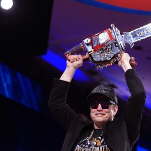 CEO of Tesla and SpaceX Elon Musk leaves the stage holding a chainsaw after speaking at the Conservative Political Action Conference (CPAC) at the Gaylord National Resort Hotel And Convention Center on February 20, 2025 in Oxon Hill, Maryland.