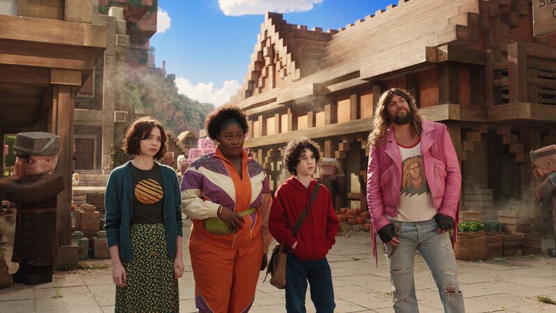 (L-R) Emma Myers, Danielle Brooks, Sebastian Hansen, and Jason Momoa in A Minecraft movie.