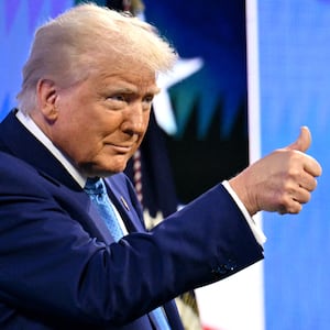 Donald Trump makes a thumbs up gesture