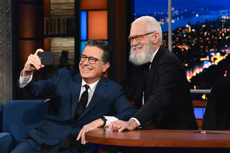 Colbert with his predecessor, David Letterman, during a November 2023 show