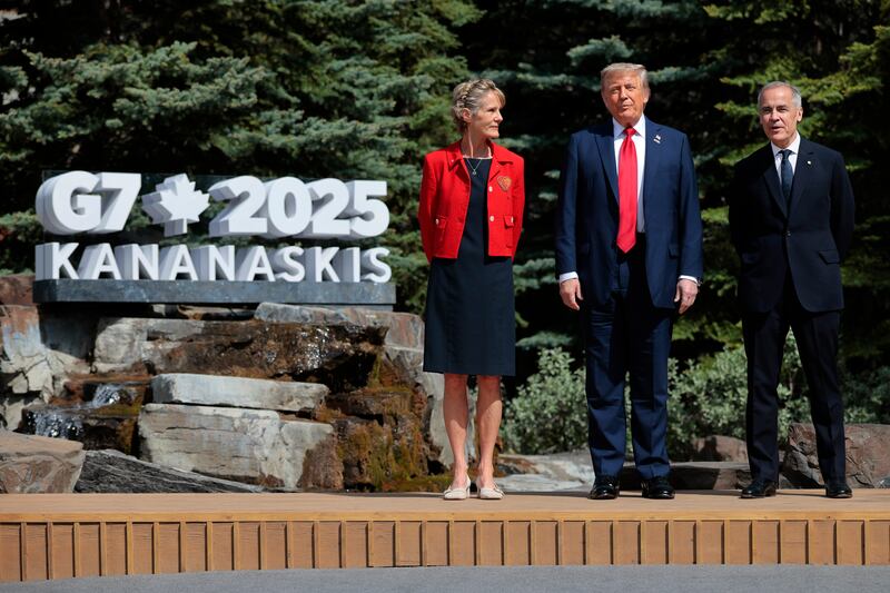 President Donald Trump  poses for a photo with Canadian Prime Minister Mark Carney and his wife Diana Fox Carney at the official welcome ceremony during the G7 Leaders' Summit on June 16, 2025 in Kananaskis, Alberta, Canada.