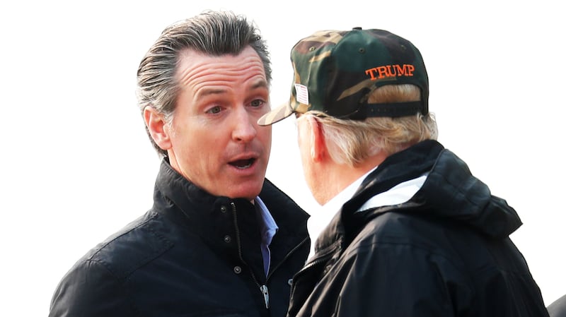 Donald Trump speaks with Gavin Newsom at Beale Air Force Base, California, U.S., November 17, 2018.