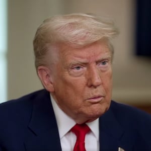 A close-up of Donald Trump being interviewed in the Oval Office.