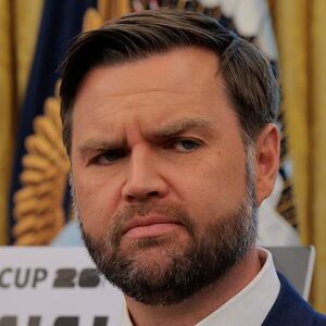 JD Vance looks at Donald Trump
