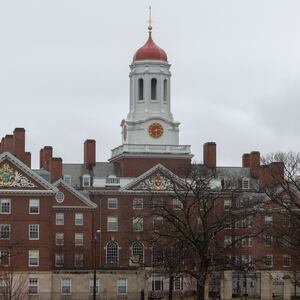 A person runs past Dunster House at Harvard University on March 17, 2025 in Cambridge, Massachusetts.