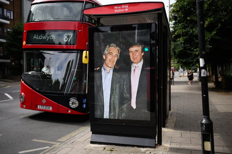 LONDON, ENGLAND - JULY 17: A photograph of US President Donald Trump and convicted child sex offender Jeffrey Epstein is displayed after being unofficially installed in a bus shelter on July 17, 2025 in London, England. The satirical artist behind the stunt has previously targeted Elon Musk and Tesla. The US president is facing criticism from his usually loyal Republican “Make America Great Again” (MAGA) supporters over suggestions that the administration is hiding details of Epstein’s crimes to protect the high profile figures he associated with, which included Trump. Having previously suggested that there was reason to investigate a rumoured list of clients, Trump has now refered to it as a hoax and called those calling for an investigation "weaklings". (Photo by Leon Neal/Getty Images)