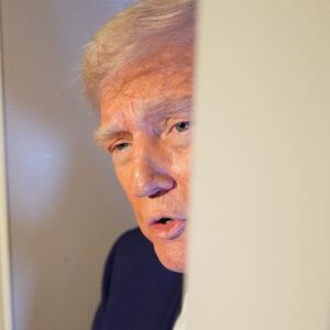 Trump talking to reporters on Air Force One