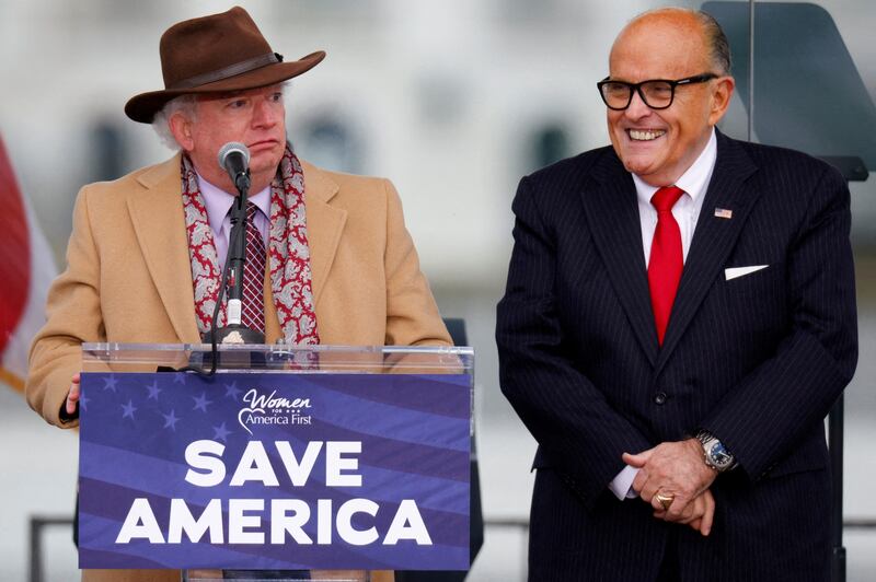 John Eastman speaks next to Rudy Giuliani as Trump supporters gather ahead of the president’s speech to contest the certification by the U.S. Congress of the results of the 2020 U.S. presidential election in Washington, January 6, 2021.