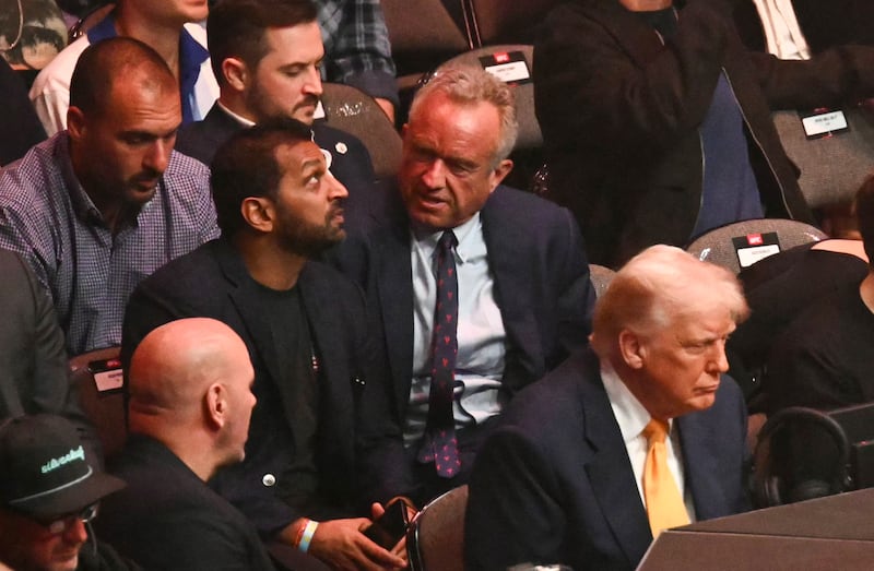 Kash Patel (left center) joins Health and Human Service Secretary Robert F. Kennedy Jr. (center) and President Donald Trump (right) at UFC fight in Miami in April.